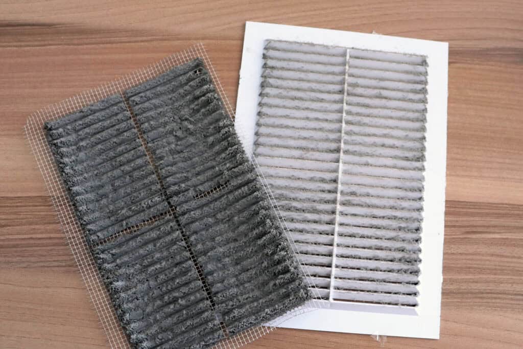 a dirty air filter on a table
